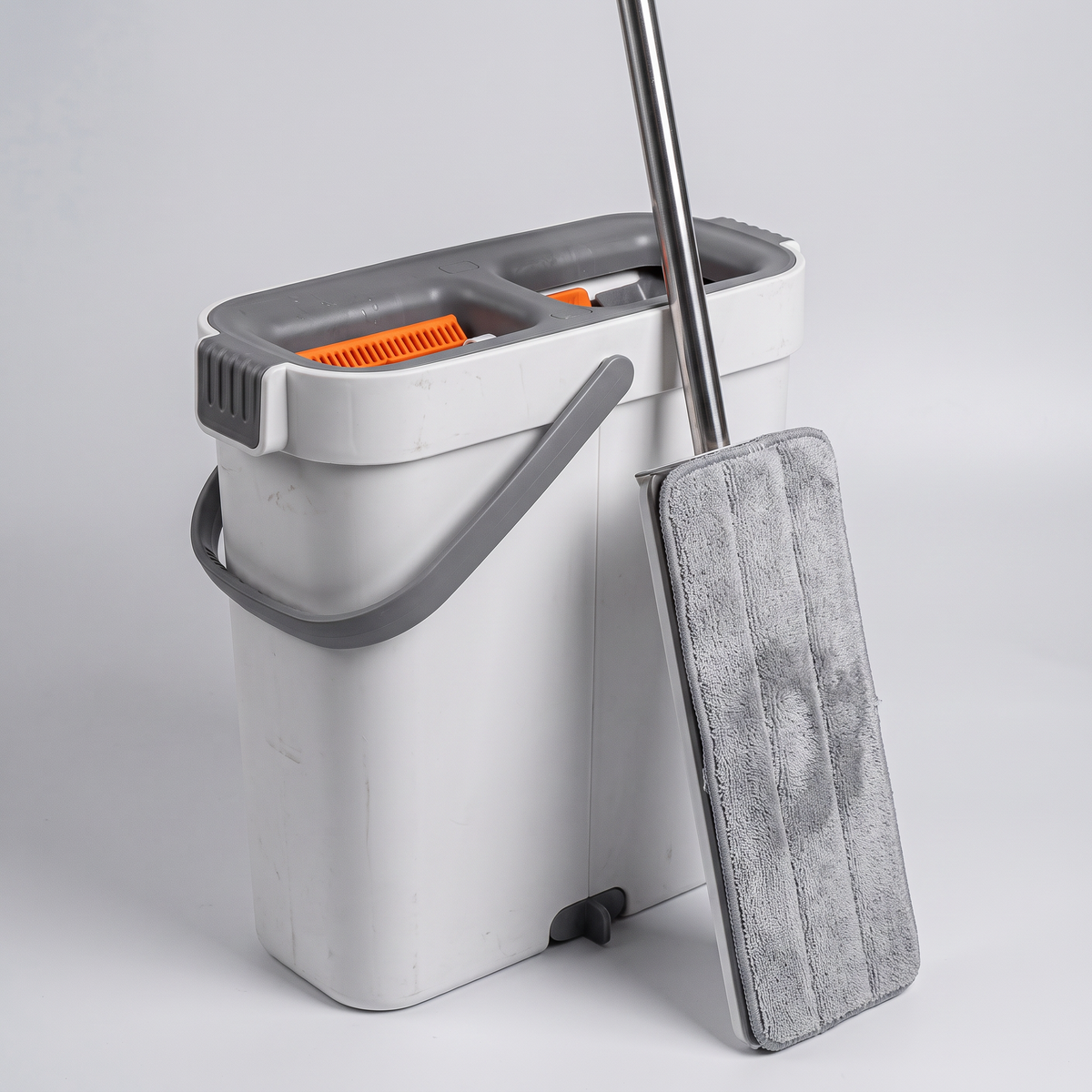 Hands-free flat mop and bucket set on a clean white studio background, product catalog photo