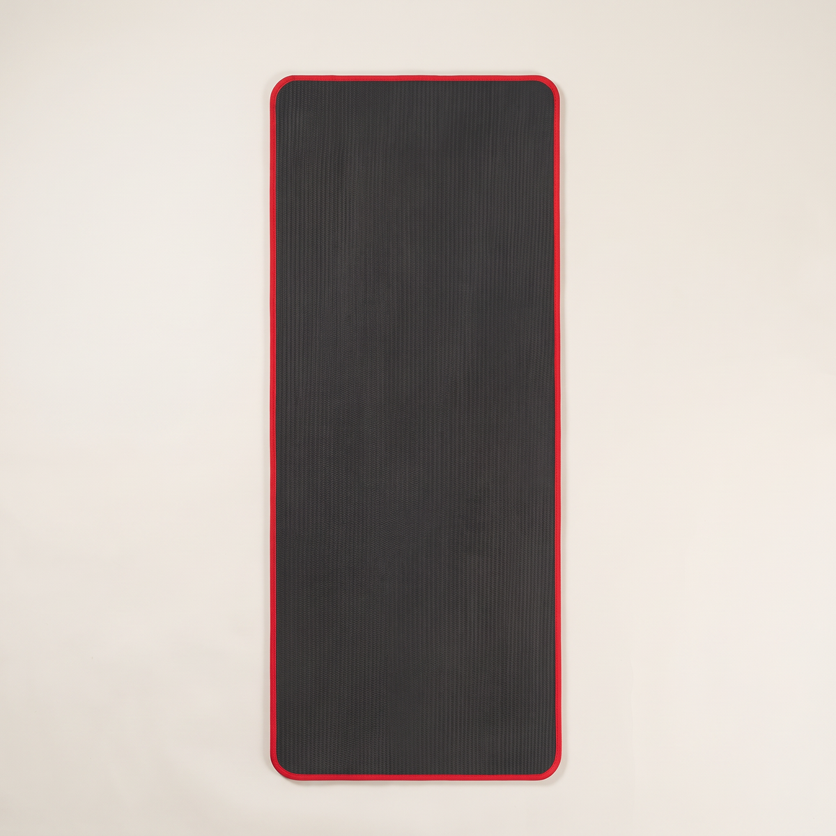 Thick yoga mat on clean white studio background
