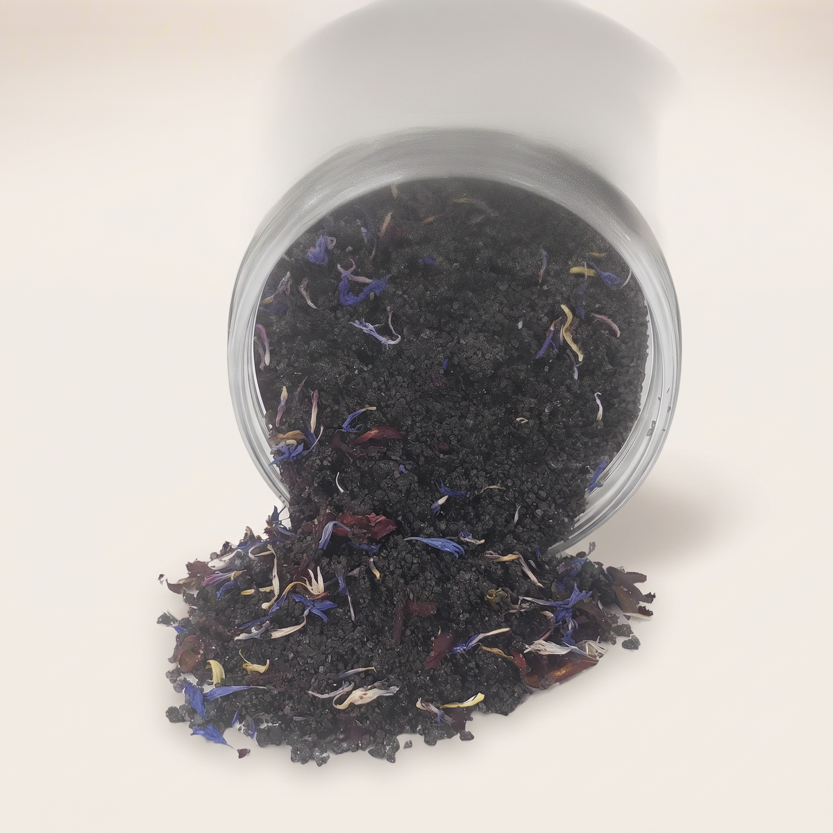 Black lava salt bath soak jar on clean white studio background