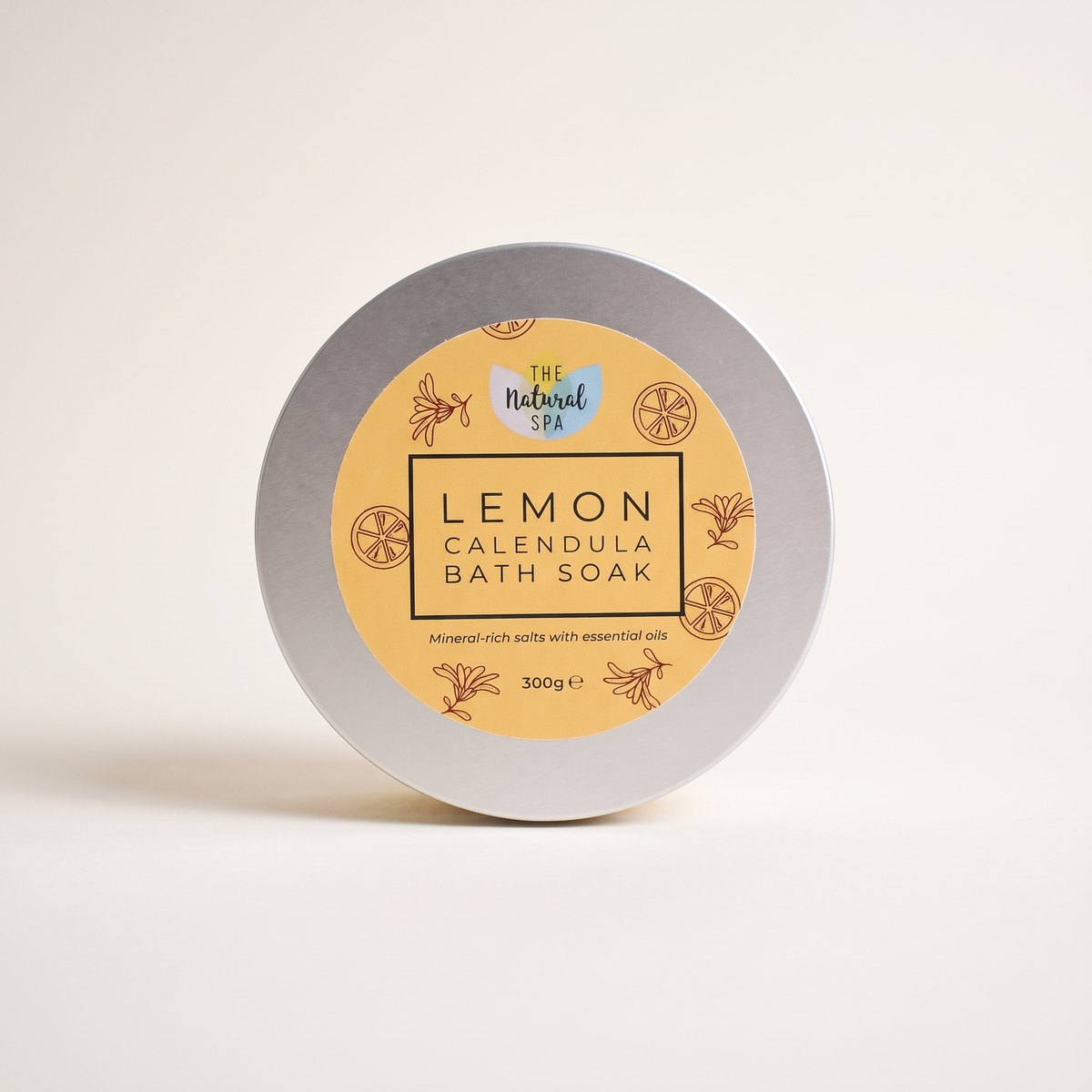 Lemon calendula bath soak tin on clean white studio background