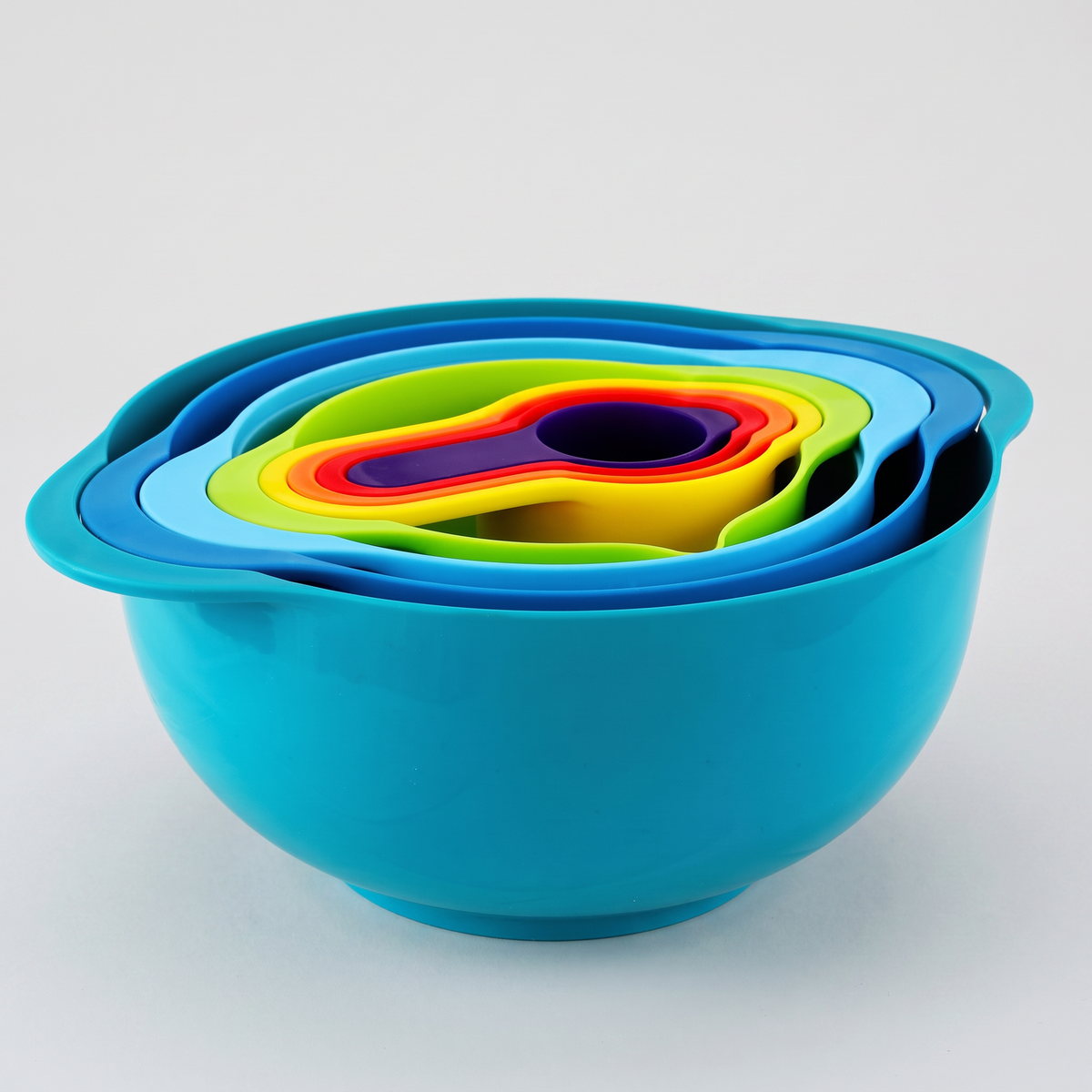 Stackable mixing bowl and measuring cup set on a clean white studio background, product catalog photo