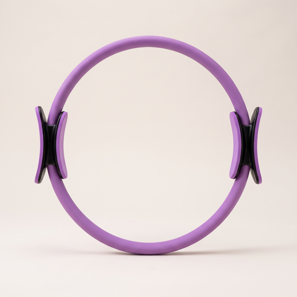 Pilates resistance ring on clean white studio background