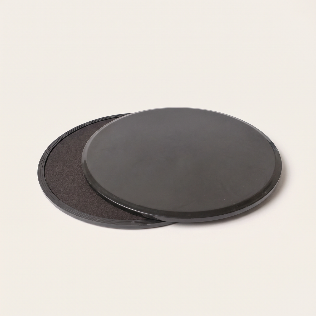 Pilates slide plates on clean white studio background