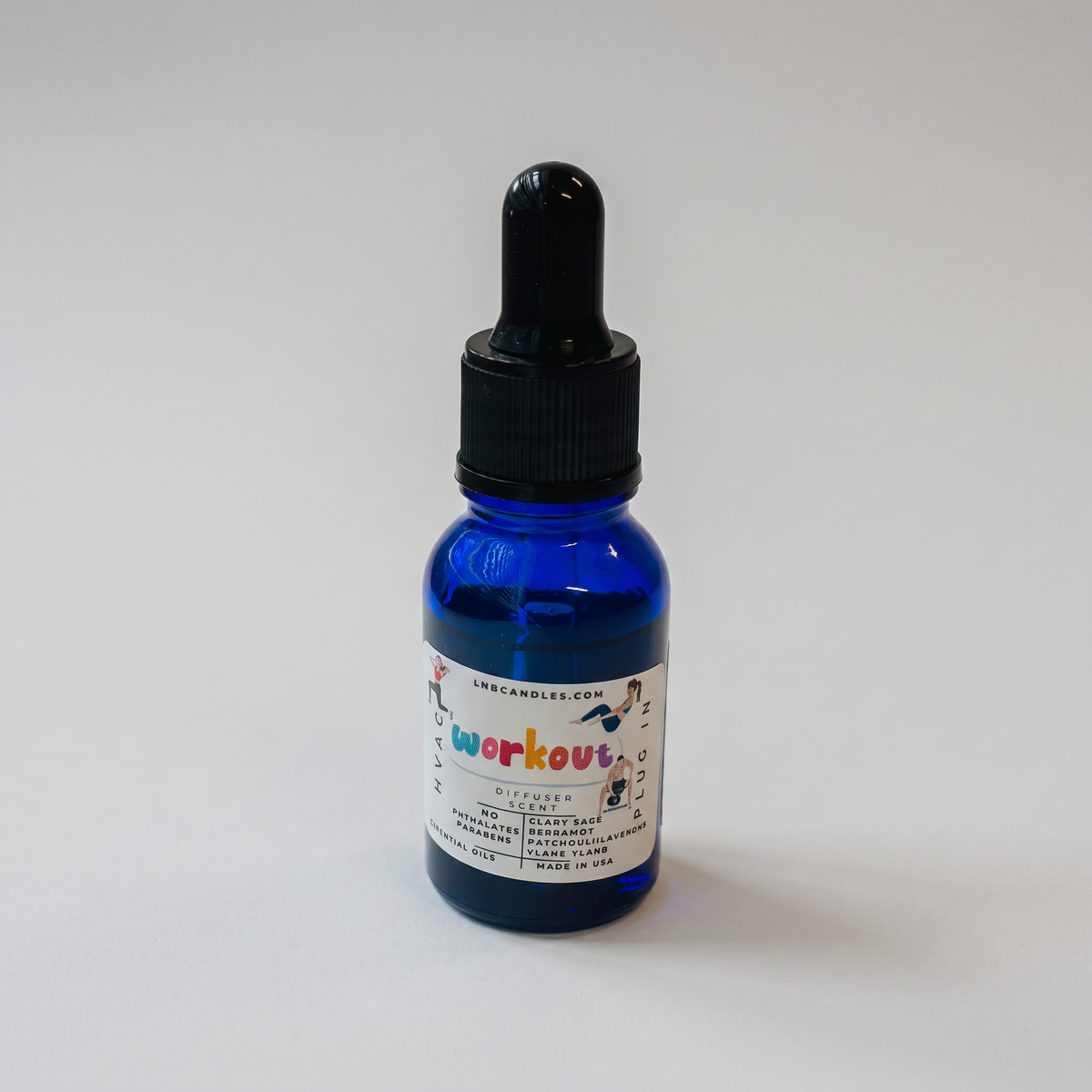 Workout essential oil blend bottle on a clean white studio background, catalog product photo